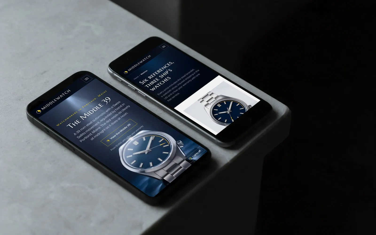 Two phones on a stone ledge showing the Middlewatch home page and watch catalog